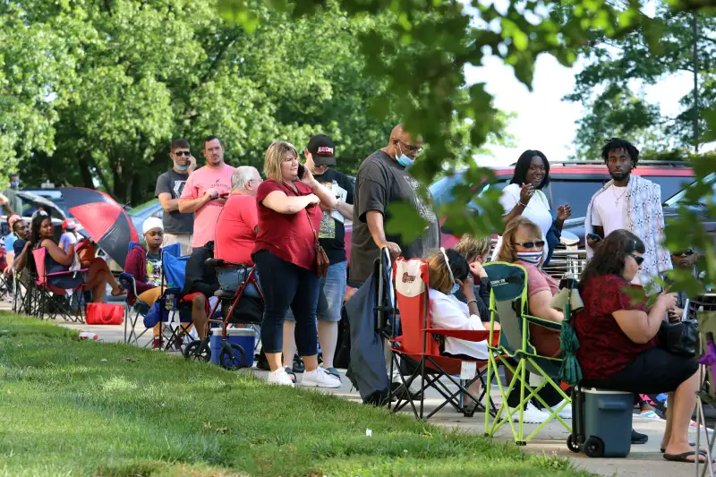 Hundreds of residents wait in long lines outside the Kentucky Career Center for help with their unemployment claims