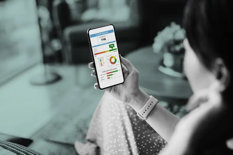 Close up of a woman looking at her credit report on her smartphone