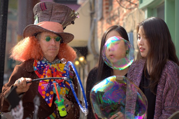 Bubble Man enchants onlookers with colorful soap bubbles in Ellicott City Maryland