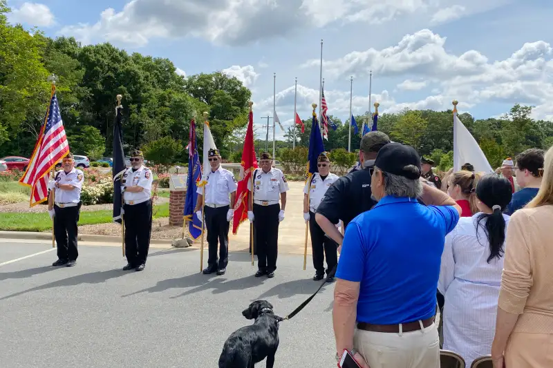 A group of senior firefighters gather at a plaza in Indian Trail North Carolina