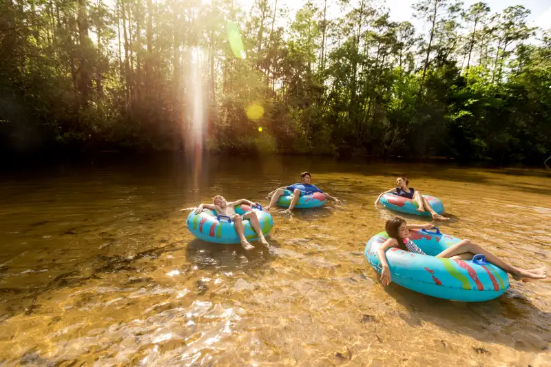 A family tubing at Blackwater River in Navarre Florida