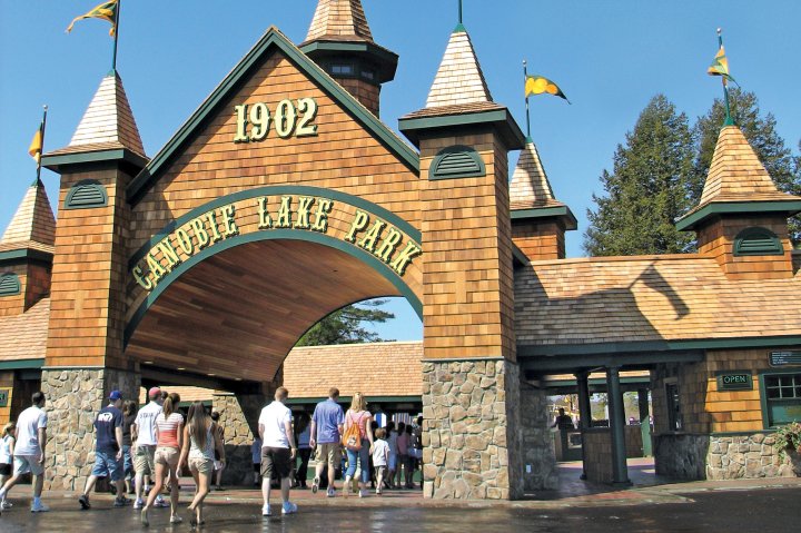 People walk in through the main entrance at Canobie Lake Park in Salem New Hampshire