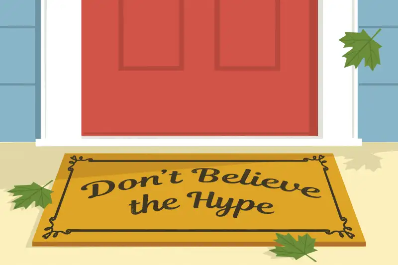 Don't Believe The Hype writing on a doormat in front of a new house.