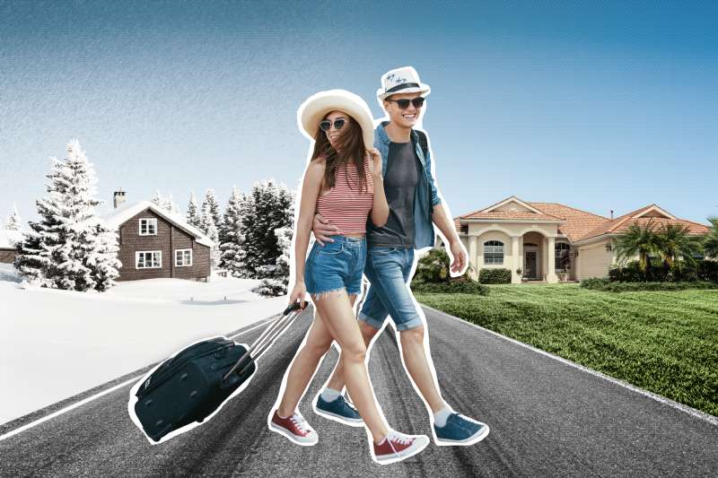 A young snowbird couple crossing a road from one house in winter to a house in the summer