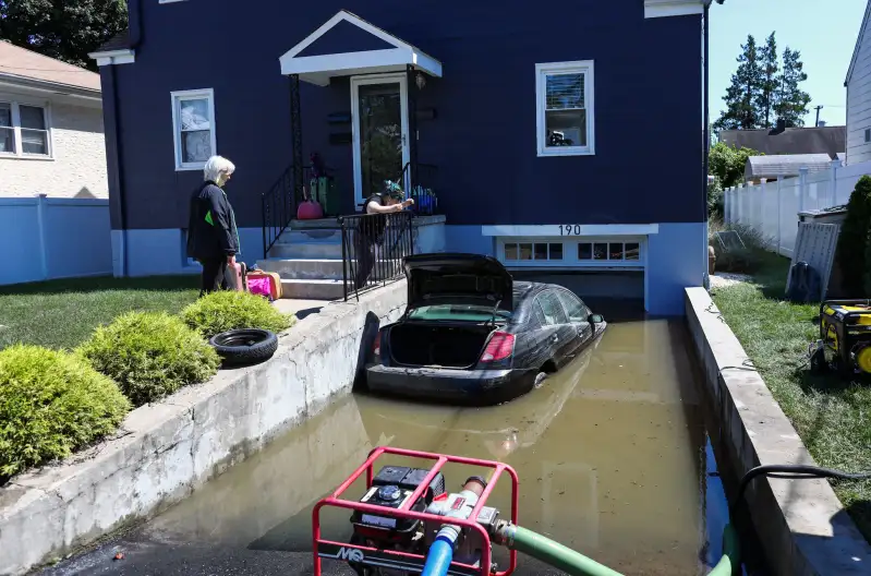 A car sits on a flooded garage of a house following a night of heavy wind and rain from the remnants of Hurricane Ida on September 02, 2021 in Mamaroneck, New York