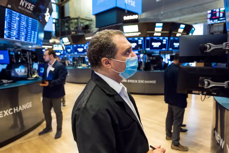 Traders work on the floor of the New York Stock Exchange in New York, USA, 06 August 2021