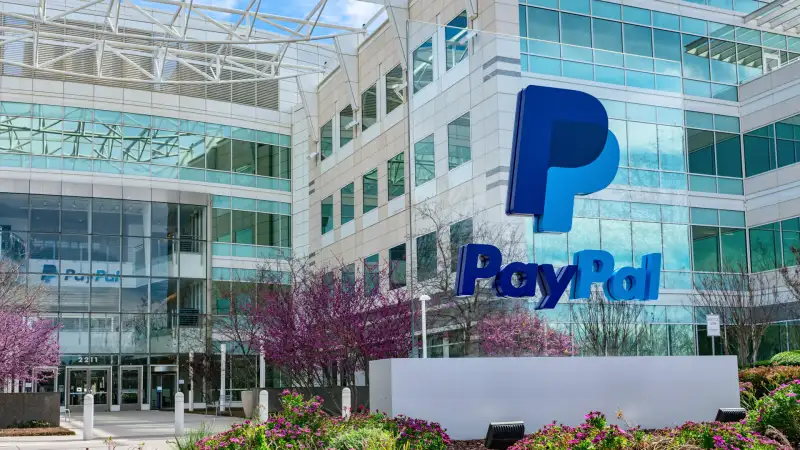 PayPal logo and sign in front of the PayPal Holdings headquarters building in Silicon Valley