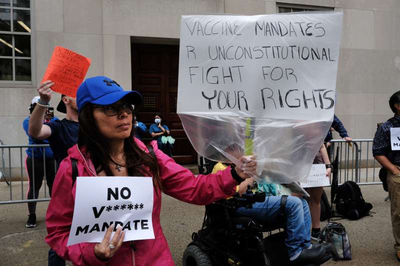 A small group of anti-vaccination protesters gather outside of New York-Presbyterian Hospital on September 01, 2021 in New York City.