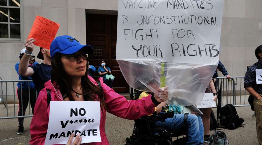 A group of anti-vaccination protesters gathers outside of New York-Presbyterian Hospital on September 01, 2021, in New York City.