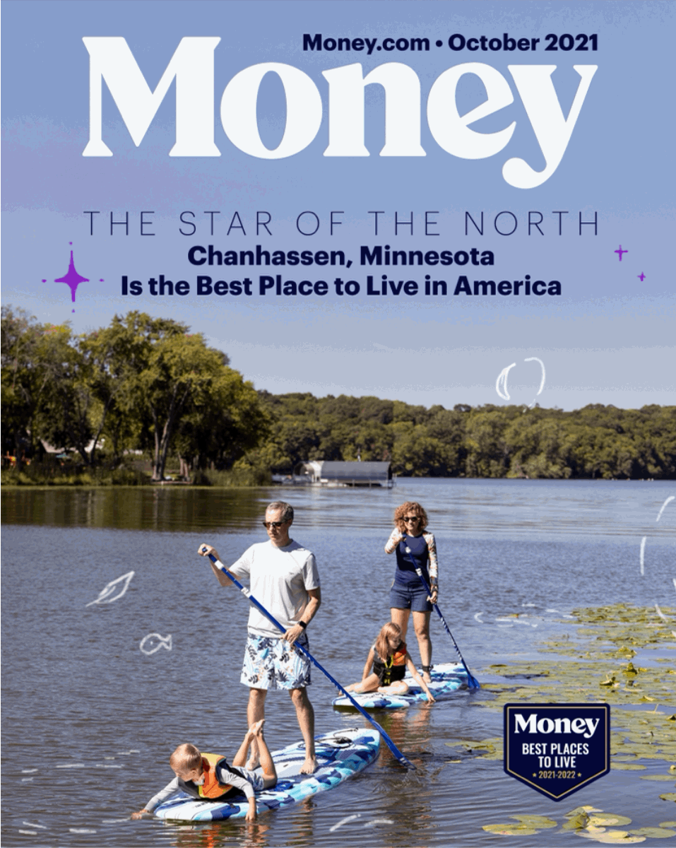 A family are paddle boarding on Lotus Lake in Chanhassen, Minnesota