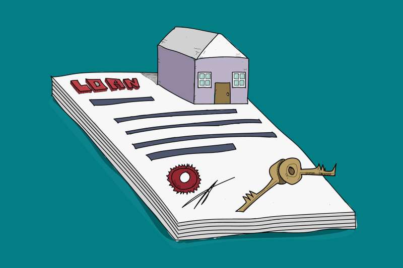 Small House On Top Of A Loan Contract With Keys On Top