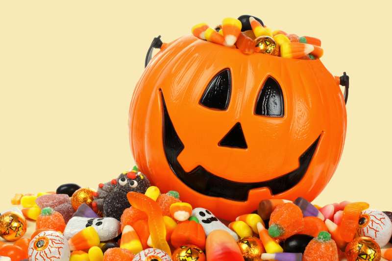Halloween Jack o' Lantern overflowing with candy