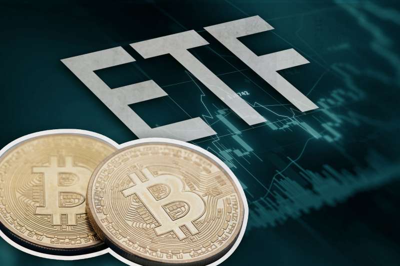 Bitcoins In Front Of Large Letters ETF Above Stock Graphics