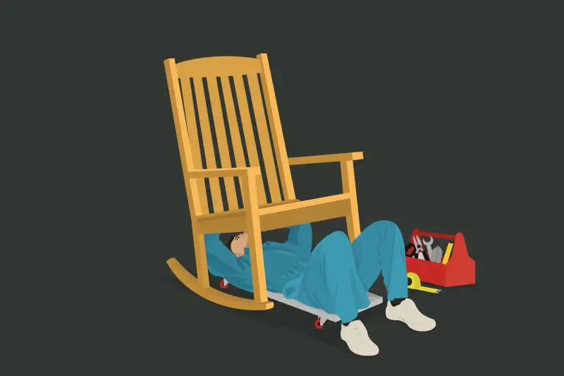 A mechanic fixing a retirement rocking chair