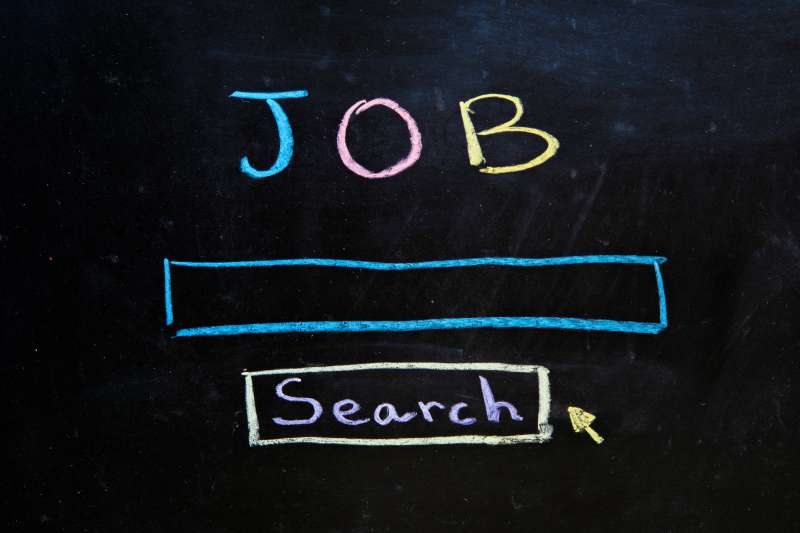 Blackboard with a job search bar drawn on it with colorful chalk