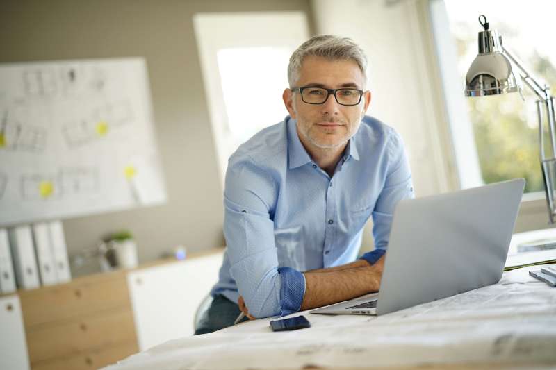 Middle aged man considering early retirement