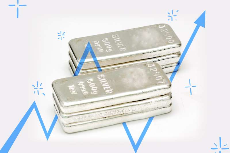 A picture of Silver ingots with a rising arrow on top signifying rise in value