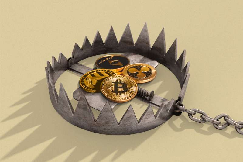 A bear trap with crypto currency coins in the center