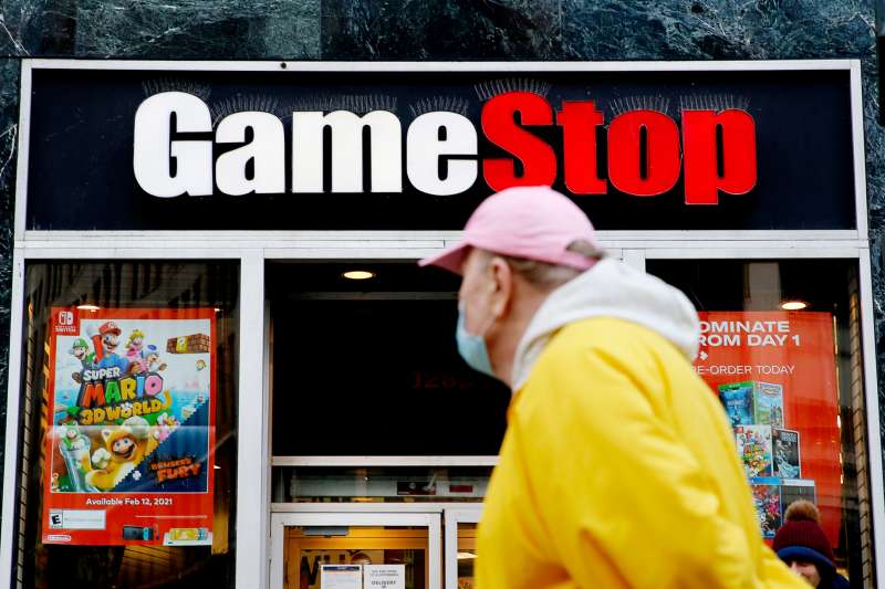 A man stops and looks at the GameStop store in New York City
