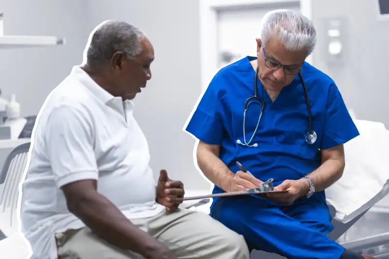 A senior man is at a routine medical check-up with his doctor..