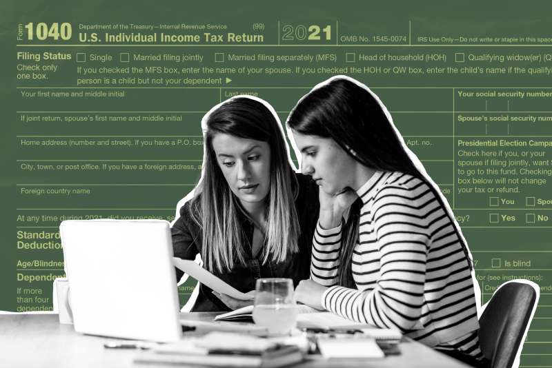 A mother and her teenage daughter sit in-front of a computer filling taxes with a 2021 Tax form in the background