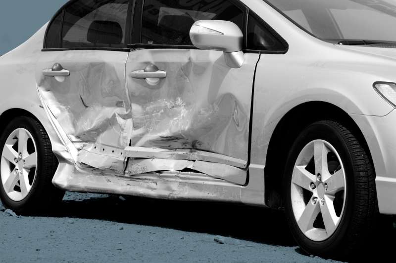 Close-up of a side impact crash on a silver car