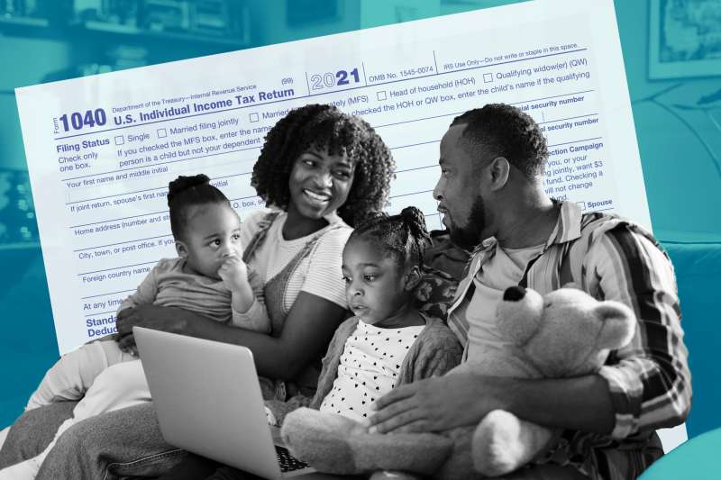 Family with kids sitting on the couch with a laptop, 2021 tax form is in the background