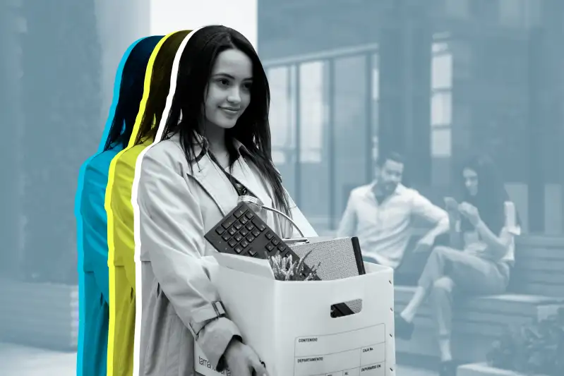 A woman is carrying her belongs in a box as she exits an office