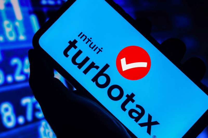 Photo of a person holding a phone with the Turbotax app