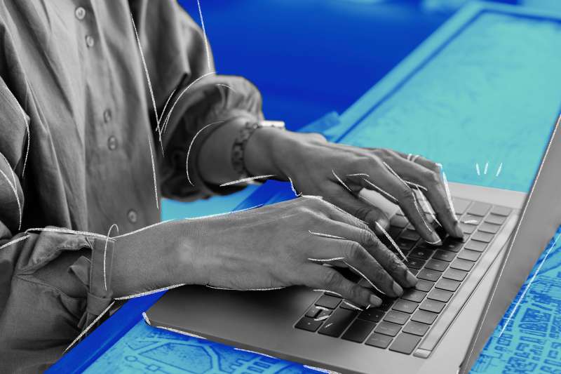 Photo illustration of a person writing a cover letter on a computer