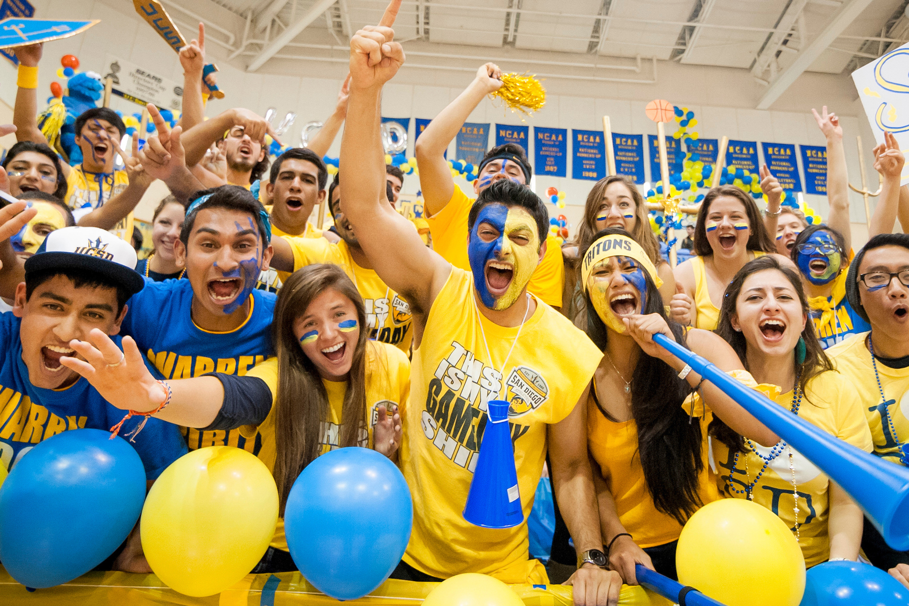 students cheering at a basketball game at UC San Diego