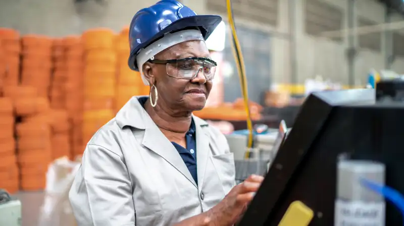 Senior woman working in a factory