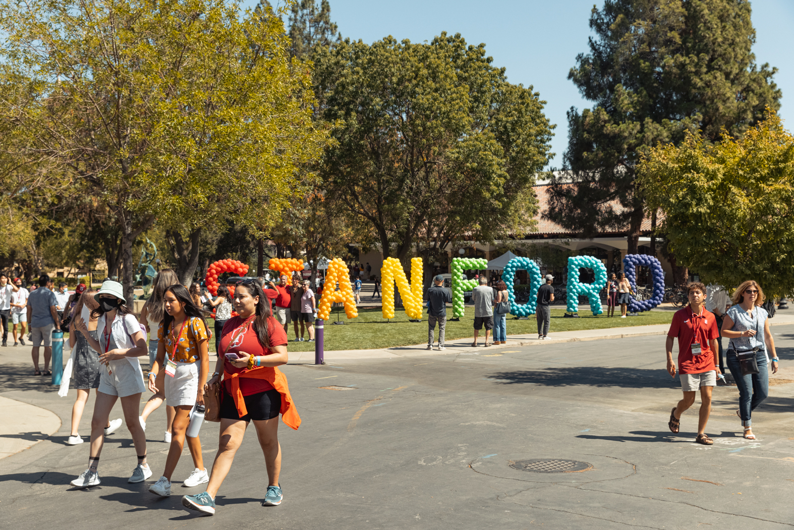 Students walk on the Stanford University Campus on a sunny day