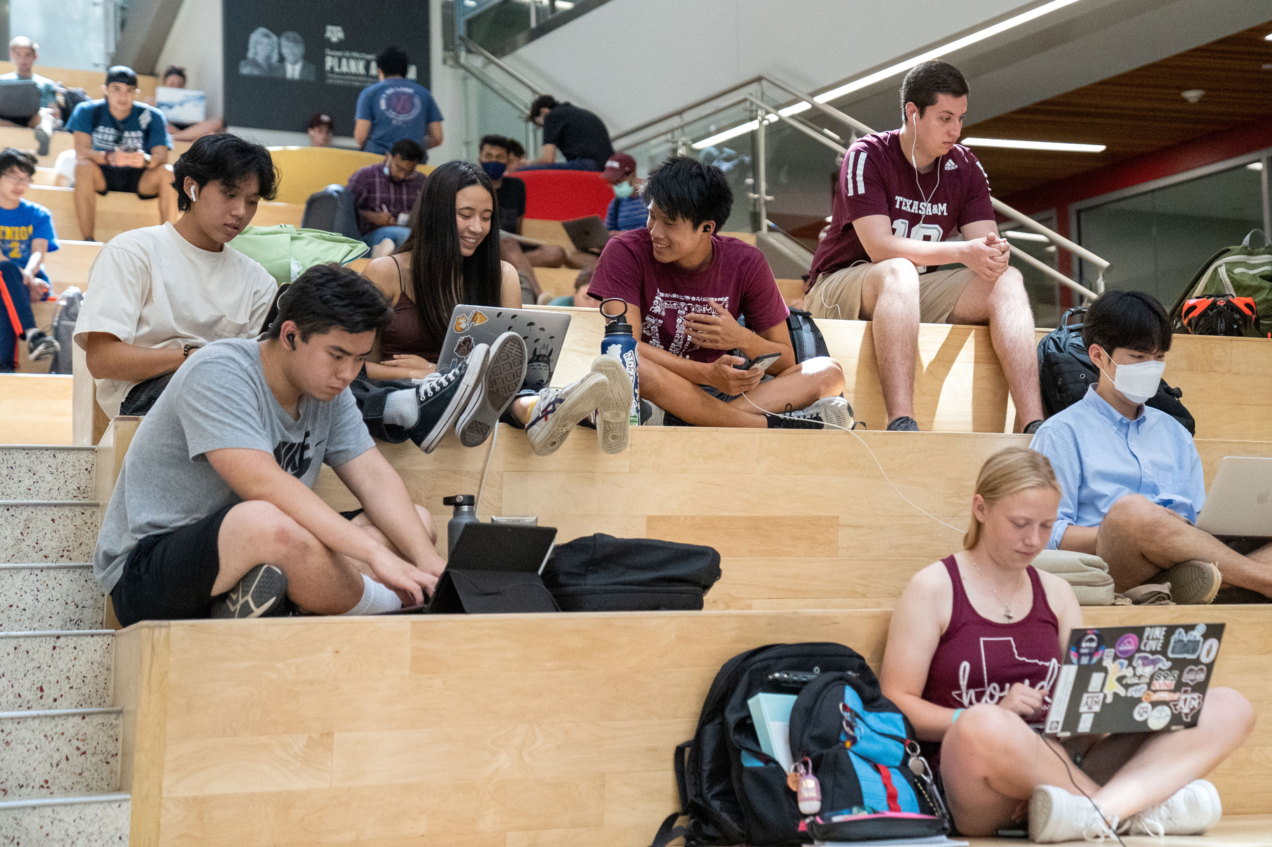 Students work on their computers on the Texas A&M University campus