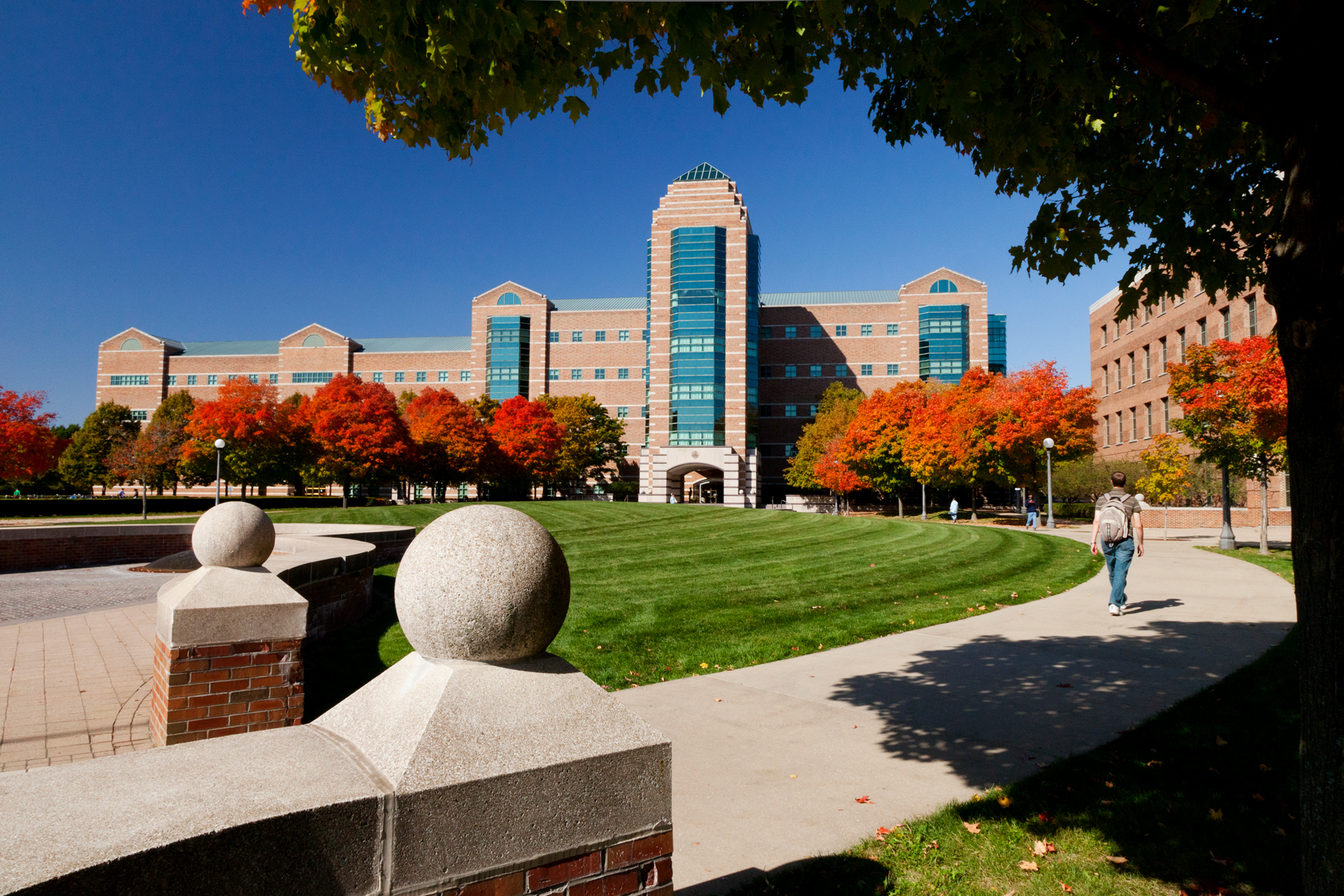 A student walks through the University of Illinois Urbana Champaign campus