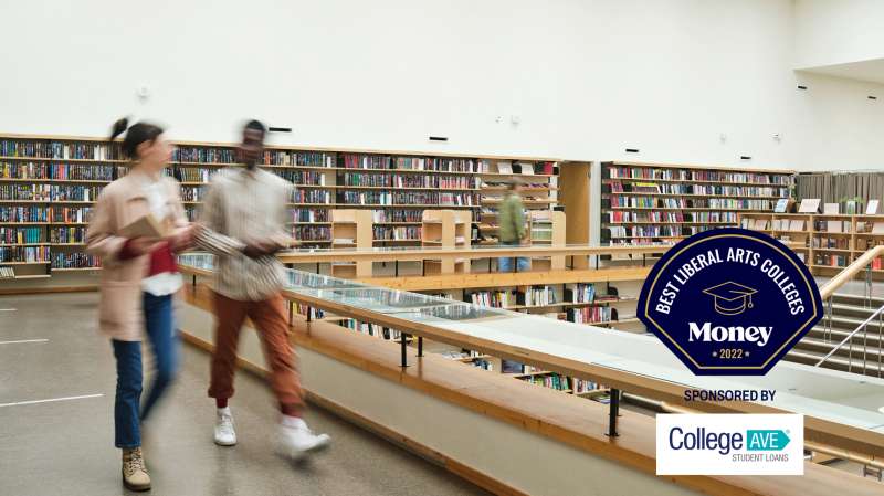 Two students walking in a college library