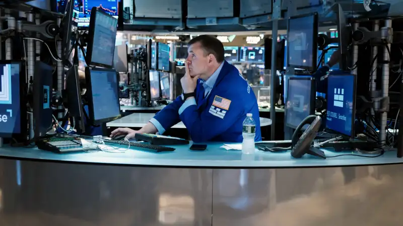 Traders work on the floor of the New York Stock Exchange (NYSE) in New York City