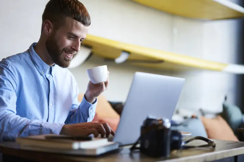 Smiling,Freelancer,Copywriter,Chatting,With,Friends,On,Websites,Via,Modern