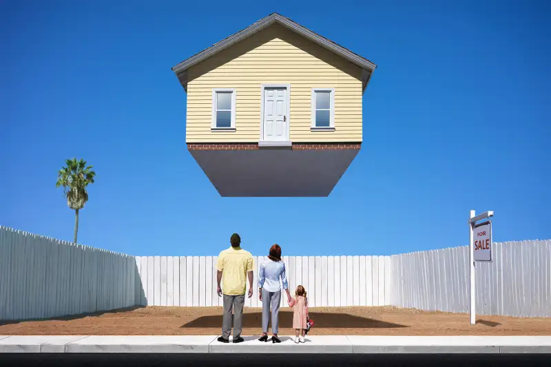 Composite of a family of three looking up at a house for sale, floating above an empty lot