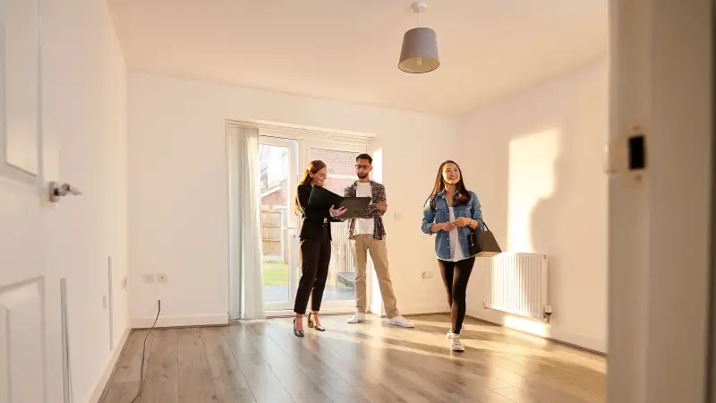 A couple at a open house with real-estate agent