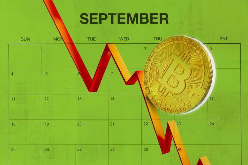 Bitcoin Rolling Down A Downwards Pointing Graphic Over A Calendar Of September