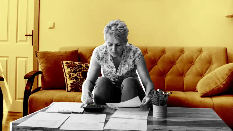 Woman looking over retirement account statements