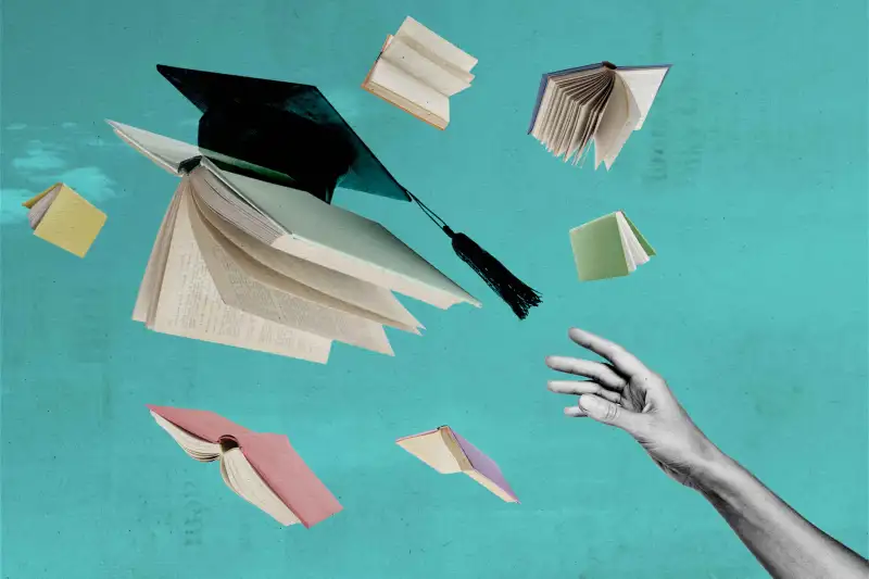 Hand Reaching Out To Flying Book. One Of the Books Has A Graduation Cap On It.