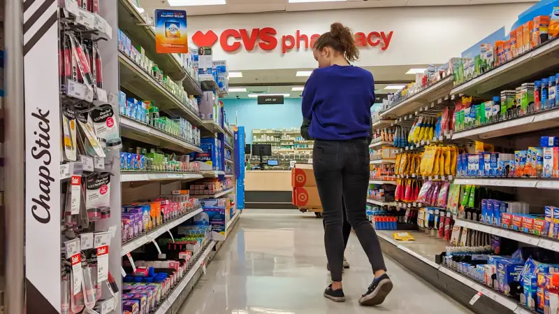 Woman browsing medicine in a CVS Pharmacy