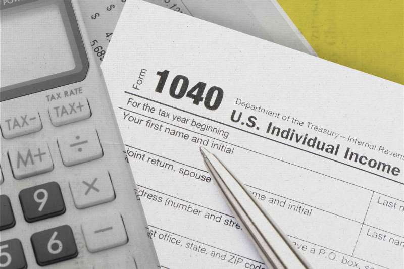 Close up of a Tax return form with calculator