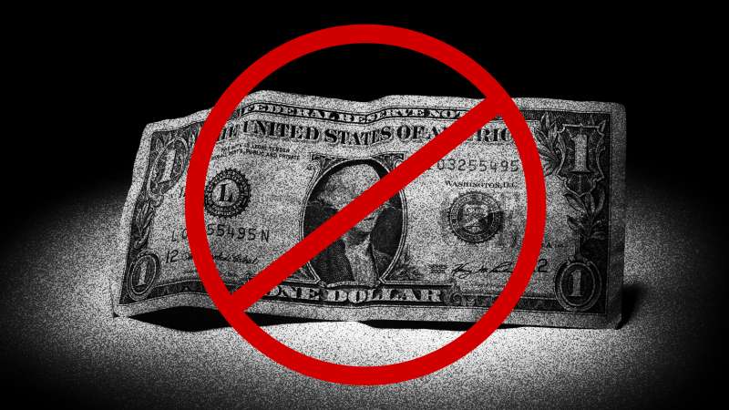 Image of a one dollar bill with a cancel sign