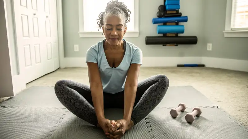 Older senior woman doing yoga