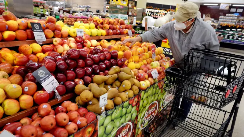 Man shopping for fruit at a supermarket