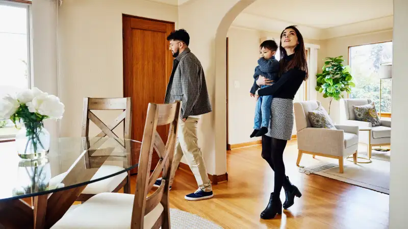 Family looking at a house for sale during an open house