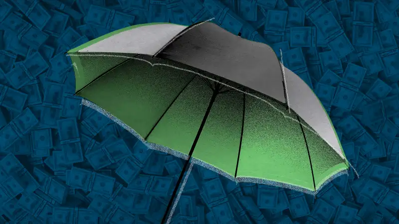 Photo illustration of an umbrella with cash in the background for a metaphor about life insurance cash outs